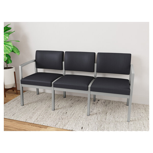 A black Lesro Lenox steel sofa with black vinyl cushions.