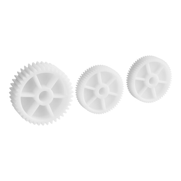 A group of white plastic gears with a hole in the center.