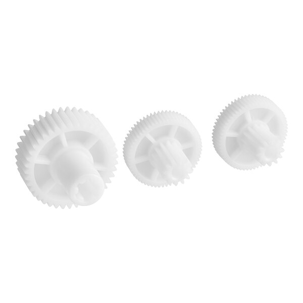 A group of white plastic gears.