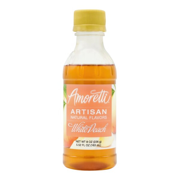 A bottle of Amoretti White Peach Artisan Natural Flavor Paste with a yellow label and cap.