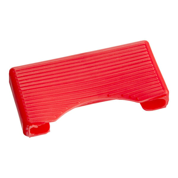 A red plastic table protector for a Tre Spade meat grinder.