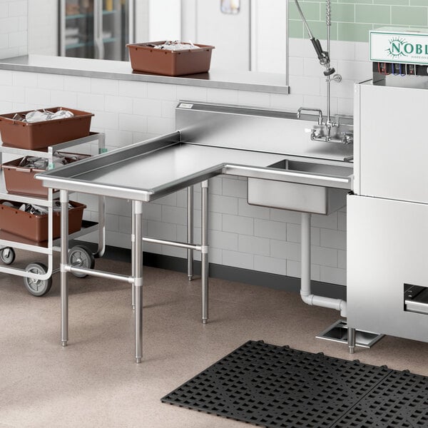 A Regency stainless steel soiled dishtable with a stainless steel sink, trash can, and trash bag.