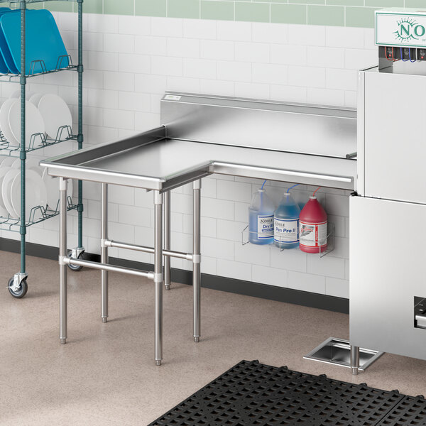 A Regency stainless steel L-shape dishtable with a sink on a counter.