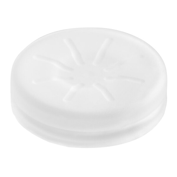 A white round silicone switch cover with a sun design.