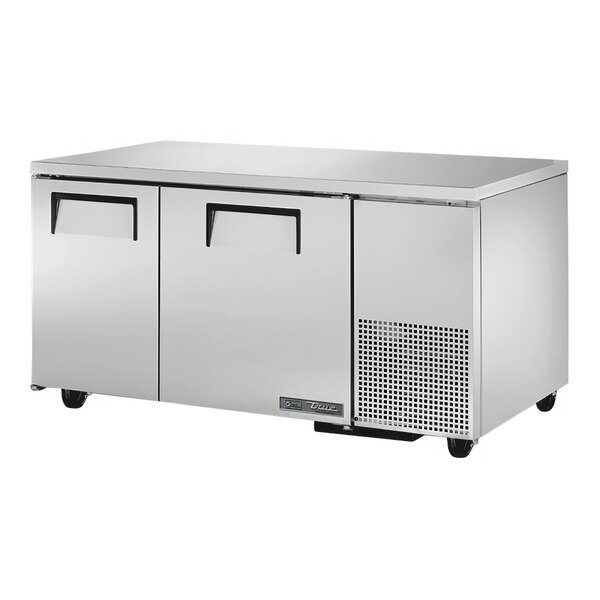 A silver True undercounter refrigerator with two doors.