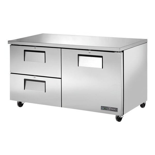 A stainless steel True undercounter refrigerator with one door and two drawers.