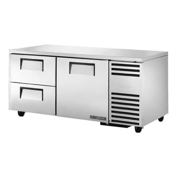 A stainless steel True undercounter refrigerator with drawers.