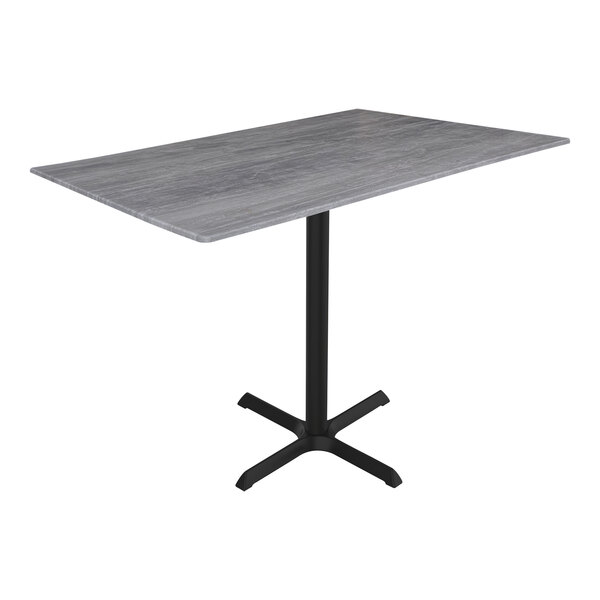 A Holland Bar Stool EuroSlim Greystone counter height table with a metal cross base.