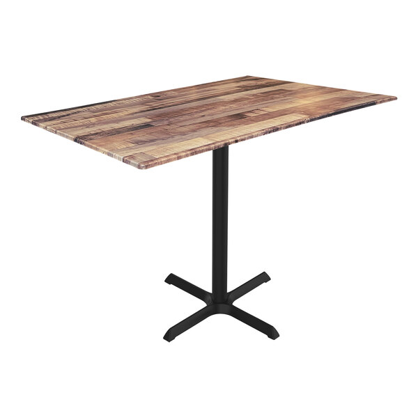 A Holland Bar Stool counter height table with a cross base and metal stand with a rustic wood top.