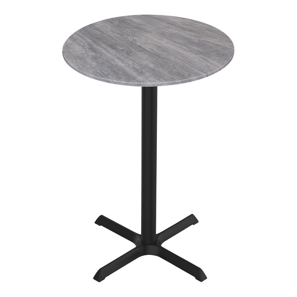 A Holland Bar Stool EuroSlim round greystone table with a black cross base.