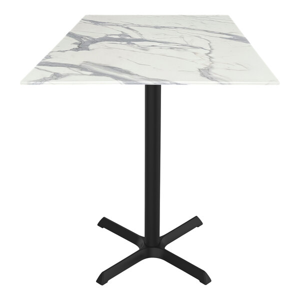 A white marble Holland Bar Stool table with a black cross base.