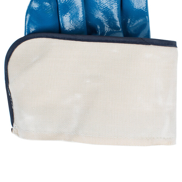 A close up of a blue Cordova Brawler glove with a white cloth inside.