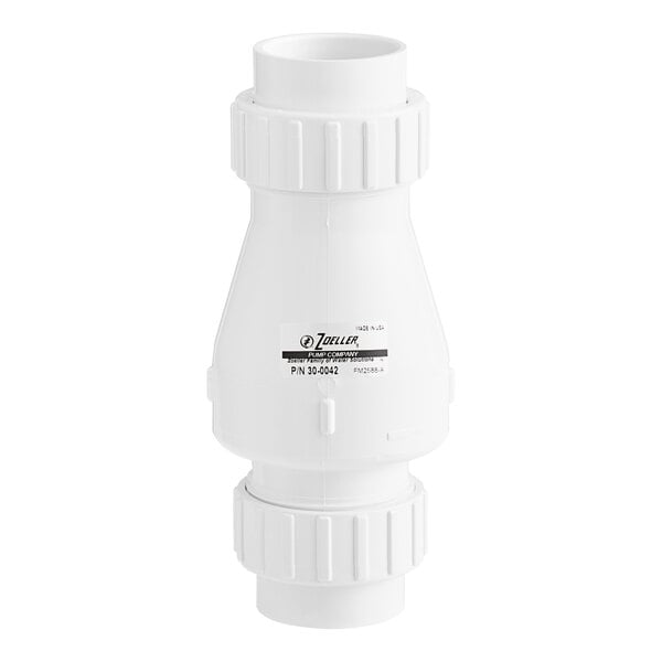 A white Zoeller Quiet Check PVC valve with a white cap.