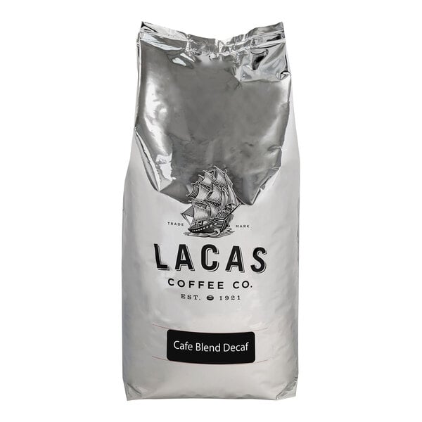 A white bag of Lacas Coffee Cafe Blend decaf whole bean coffee with a logo.