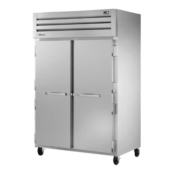 A True Manufacturing white reach-in freezer with two solid doors.