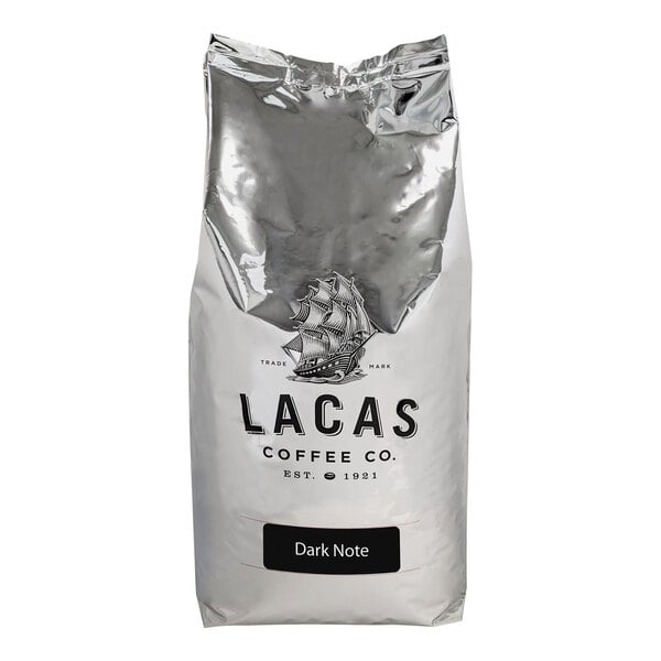 A white bag of Lacas dark roast whole bean coffee with a logo.