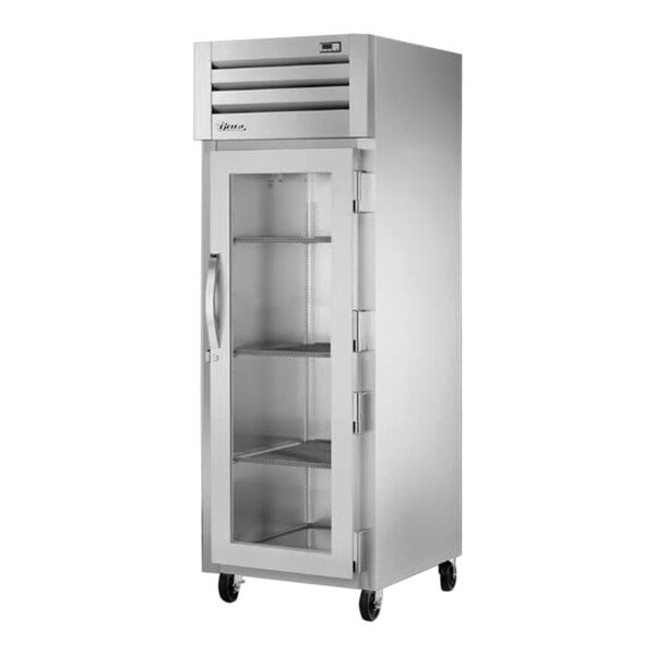 A True reach-in freezer with glass doors.