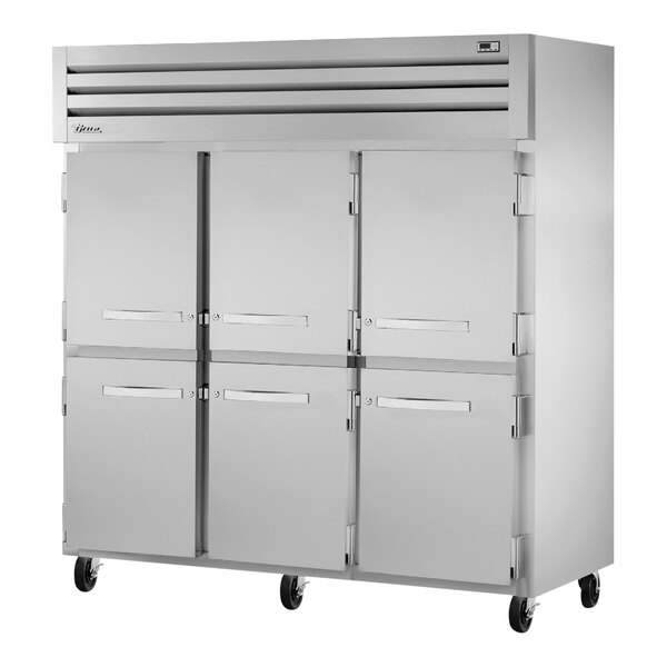 A True Spec Series reach-in freezer with solid half doors.