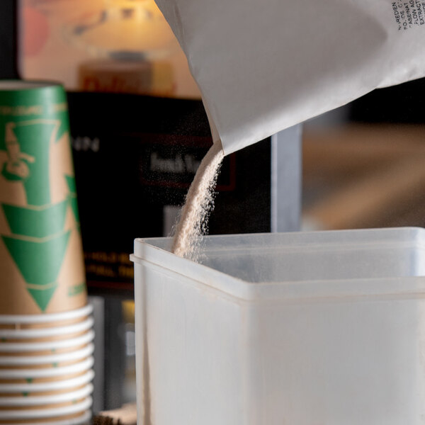A white container of HEATH Cappuccino Mix on a counter.