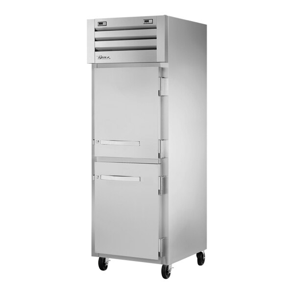 A silver True Spec Series combination refrigerator/freezer with two half doors.