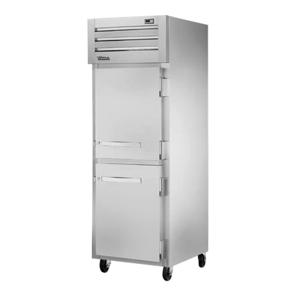A white True Spec Series reach-in freezer with silver half doors.