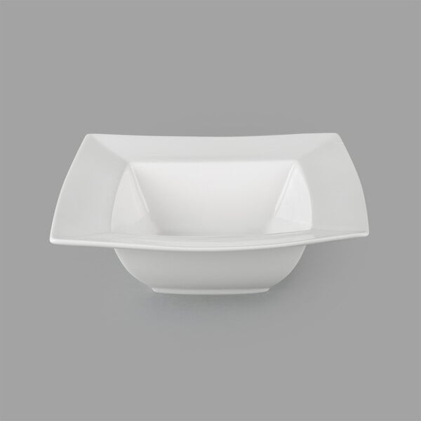 A close up of a 10 Strawberry Street Whittier white square bowl with a square edge.