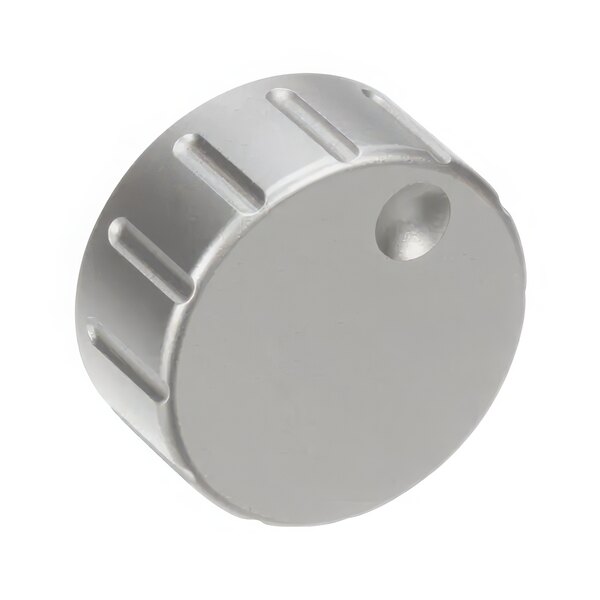 A silver circular timer knob with a hole in it.