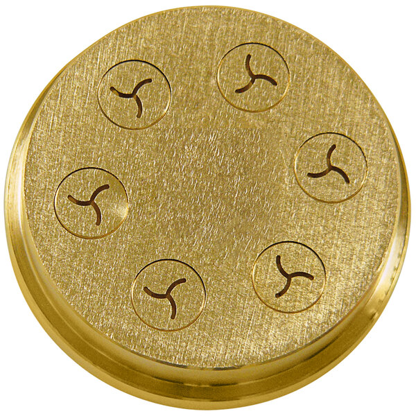 A gold circular pasta die with six holes.