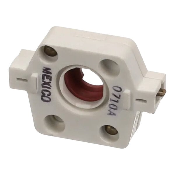 A white plastic spark switch with a red dot on it.