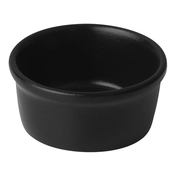 A black porcelain ramekin with a white background.