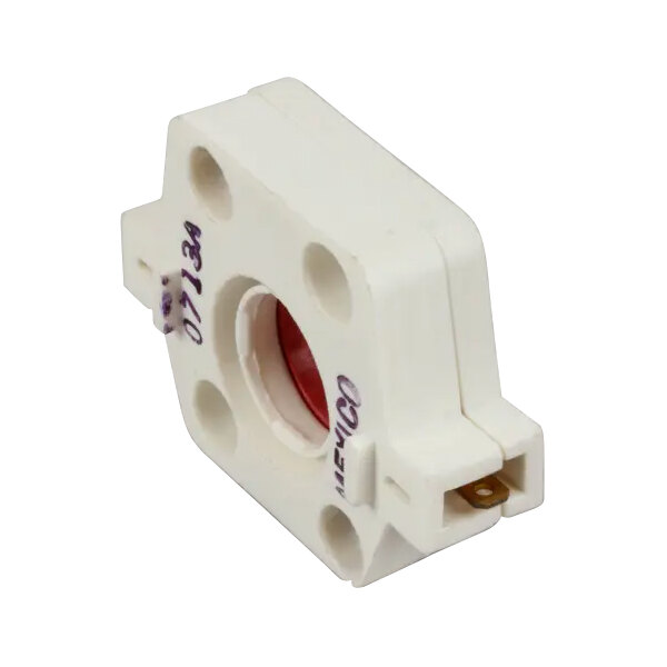 A white plastic device with a red circle on it.