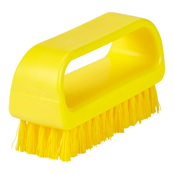 A close-up of a Remco yellow nail brush with a handle.