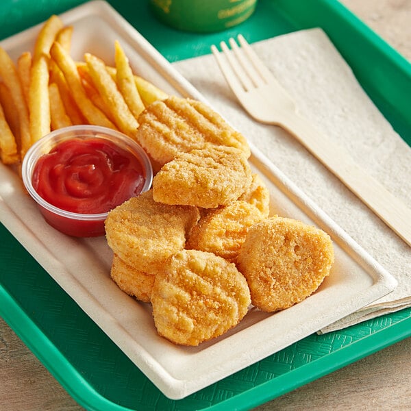 A plate of Jack & Annie's Vegan Plant-Based Chicken Nuggets with french fries and ketchup.