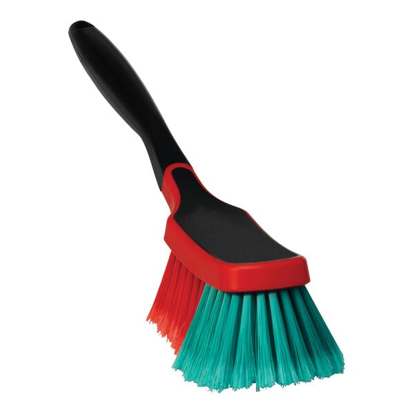 A red and green Vikan Transport multi brush with a handle.