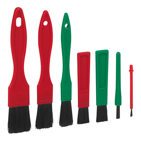 A 7-piece Vikan Transport detail brush set with green and red handles.