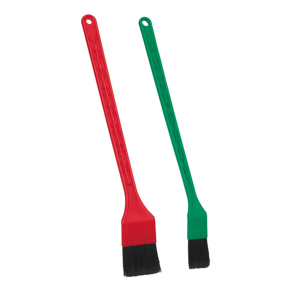 A Vikan Transport 2-piece detail brush set with green and red handles.