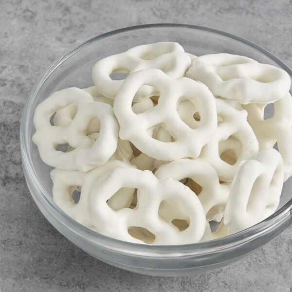 A bowl of yogurt covered pretzels.