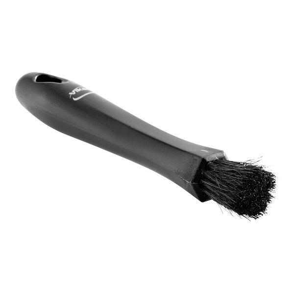 A black Vikan Transport interior brush with a handle.