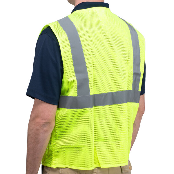 A man wearing a yellow Cordova lime high visibility vest.