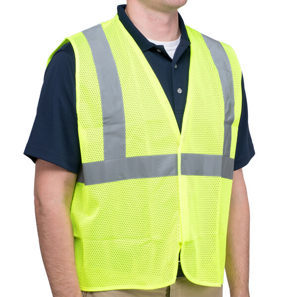 A man wearing a Cordova lime high visibility safety vest.