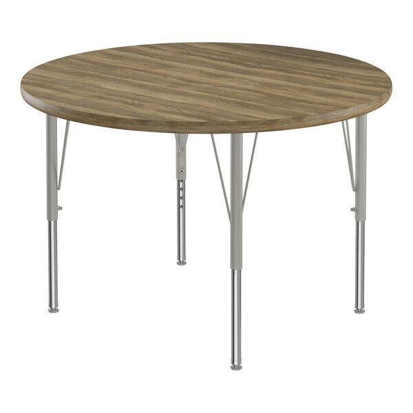 A Correll round activity table with metal legs and a hickory top.