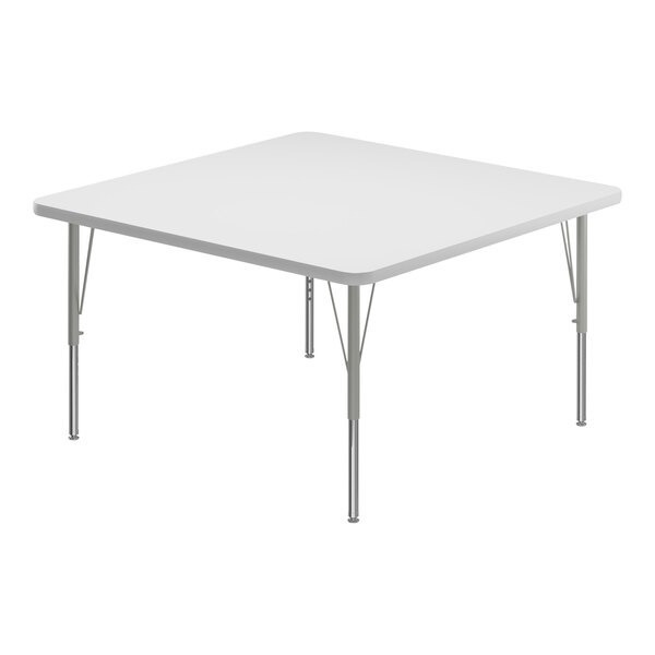 A white square Correll activity table with metal legs.