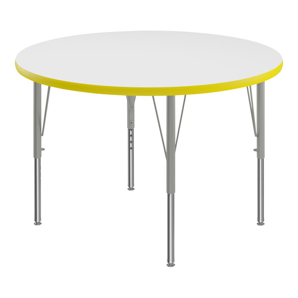A Correll white and yellow round activity table with adjustable height silver legs and a yellow T-mold.