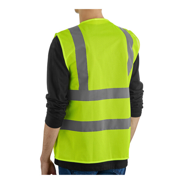 A man wearing a Lavex yellow reflective safety vest.