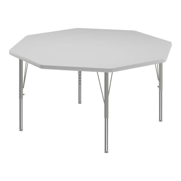 A white hexagon Correll activity table top with silver legs.