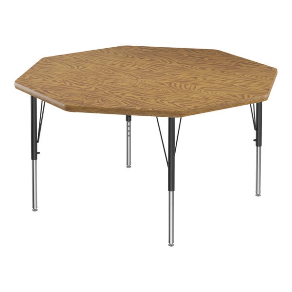 A medium oak hexagon activity table with black metal legs.
