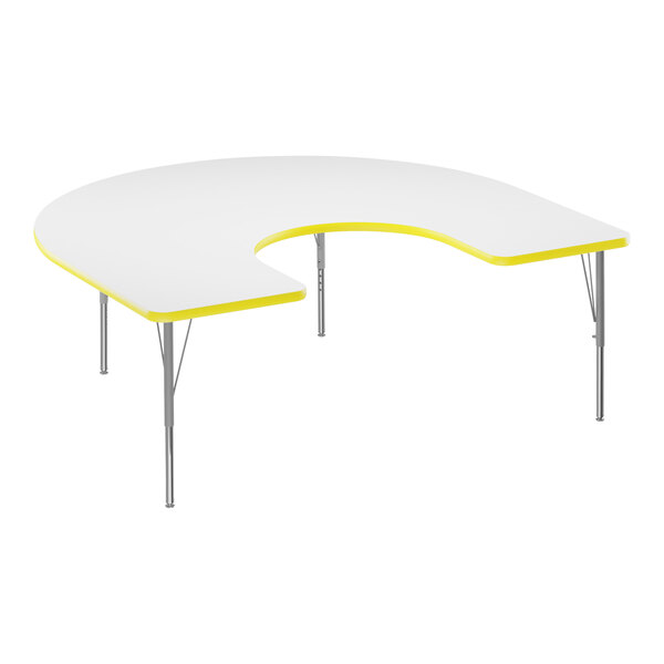 A white Correll horseshoe activity table with yellow T-mold.