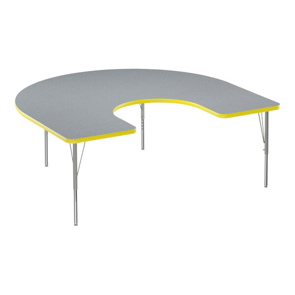 A grey high-pressure laminate activity table with a curved horseshoe top and yellow T-mold.