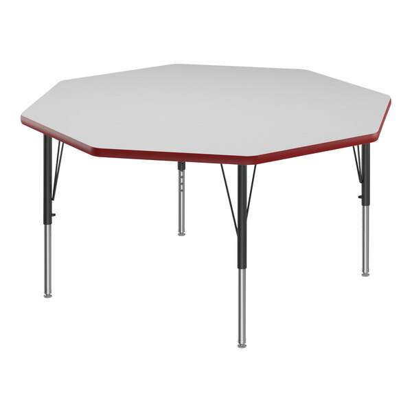 A white hexagon table with black legs and red trim.