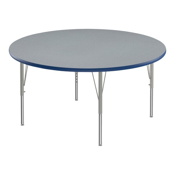 A round Correll activity table with a blue top and metal legs.